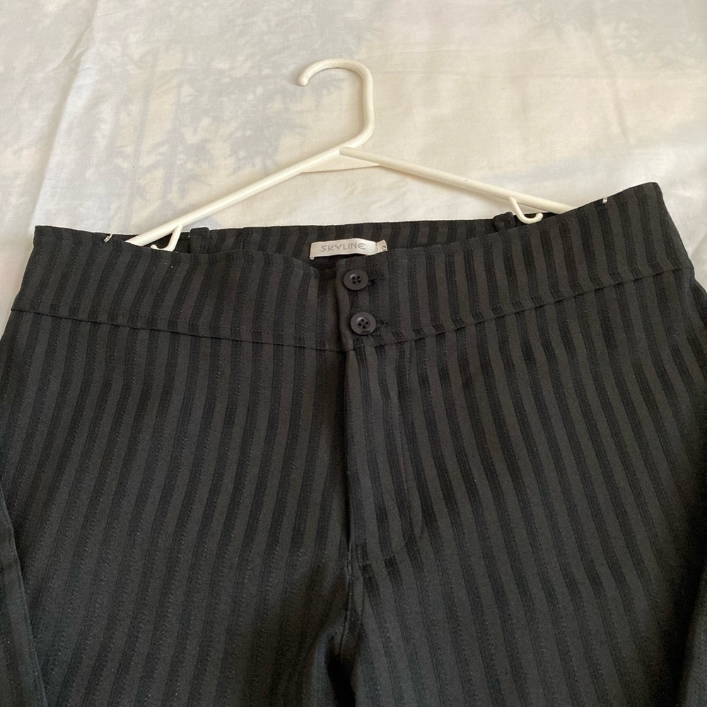 Dress Pants. Black. Long and flared at the bottom.